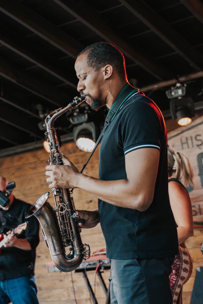 Daniel James Collective performing on saxophone