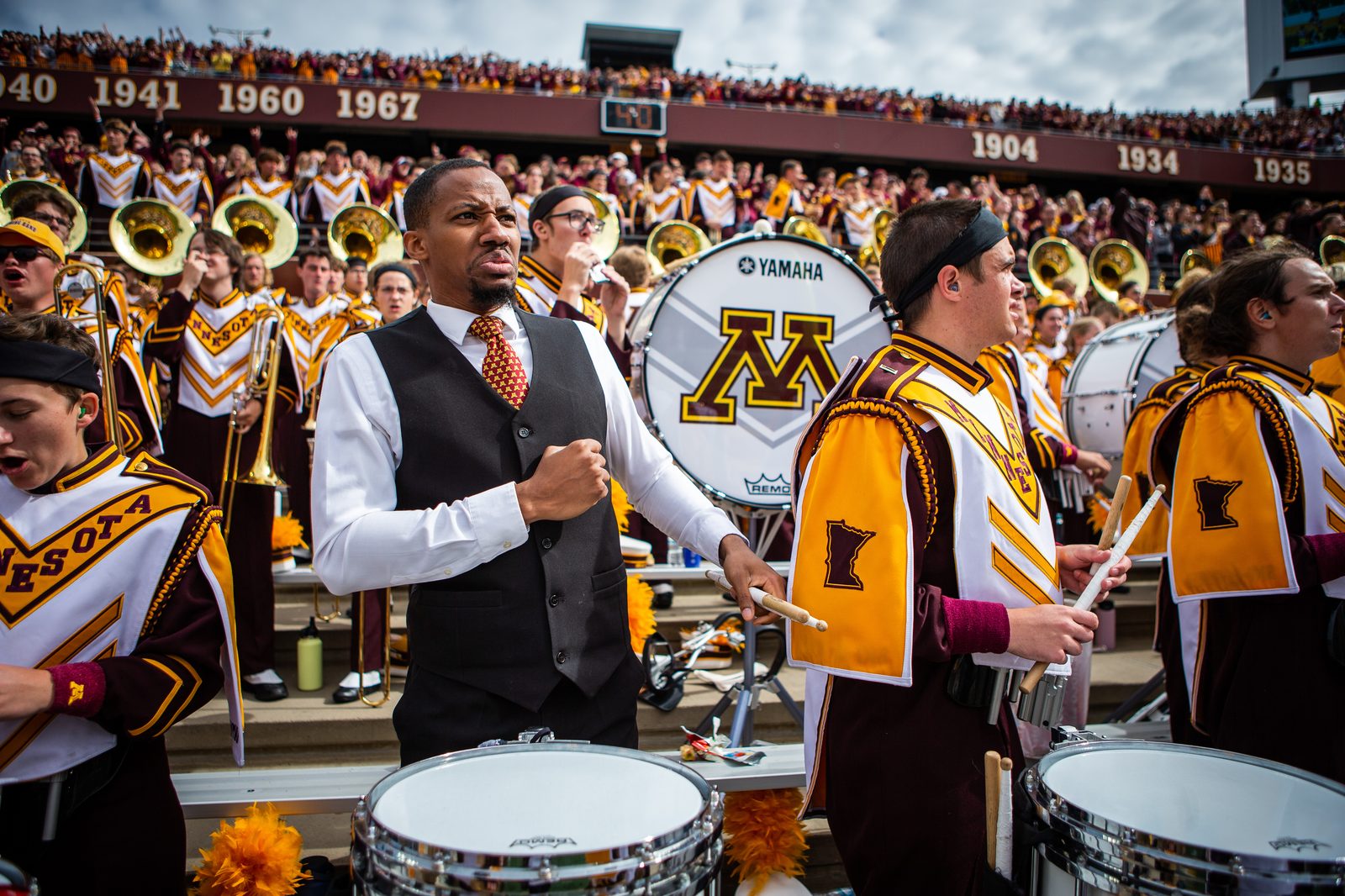Leading a college marching band drumline on game day