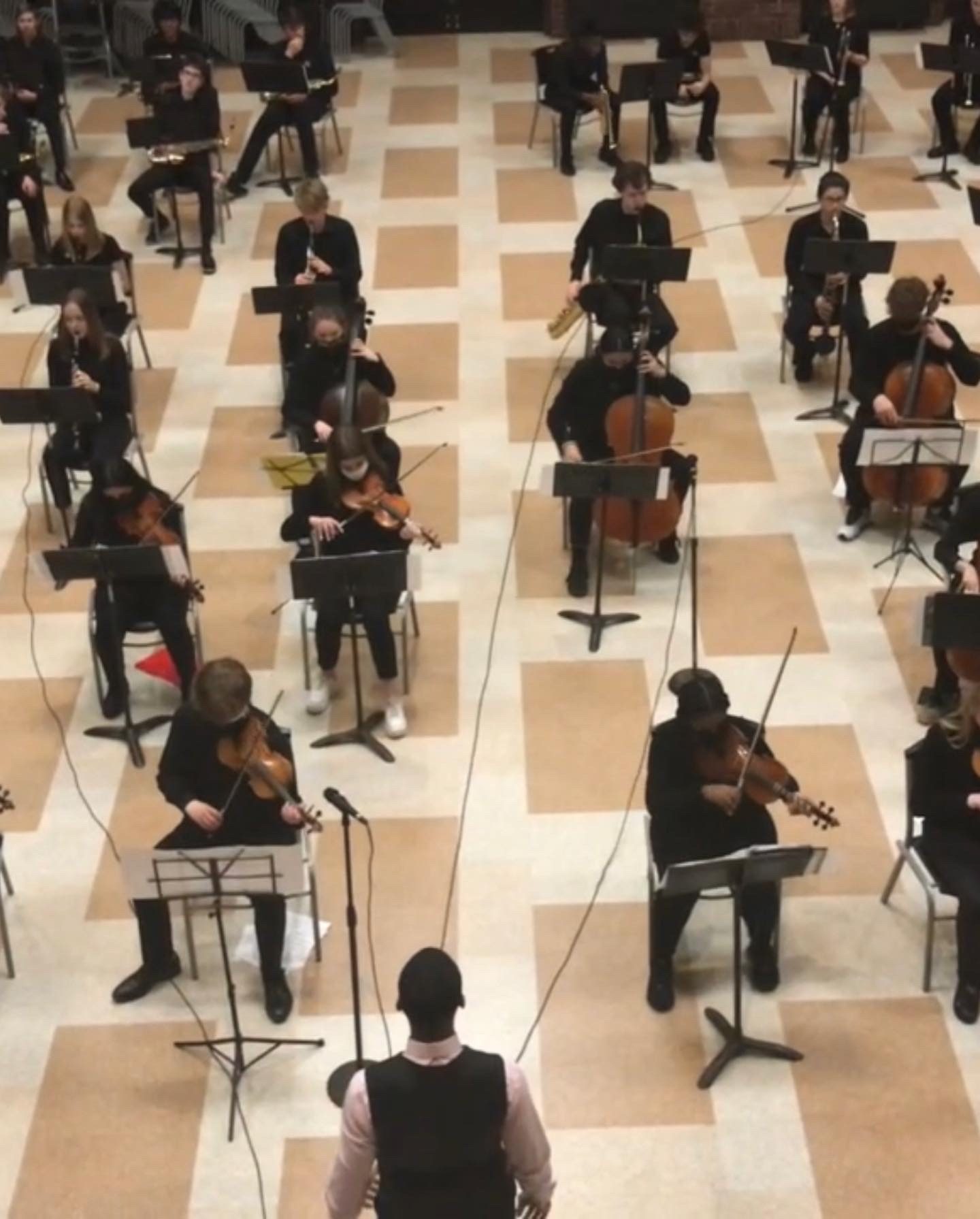 Conducting an orchestra string rehearsal