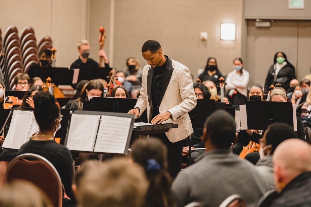 Conducting an orchestra rehearsal